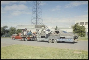 Once were warriors film crew on utility vehicle tray filming gang car on rig being towed behind, Auckland