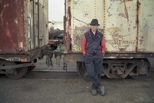 Once were warriors director Lee Tamahori posing by train