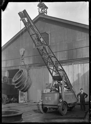 Motor driven mobile crane lifting a load of wheel frames at the Hillside Railway Workshops