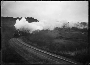A train with two "Ab" class locomotives coming up a hill.