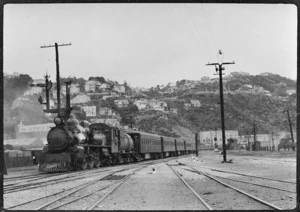 Steam locomotive hauling a passenger train