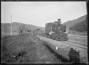 Te Karaka Railway Station, with a "Wa" class steam locomotive and goods train alongside.
