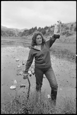 Yvonne Elia helping to clear rubbish from a lagoon in a reserve area at Cannons Creek, Porirua