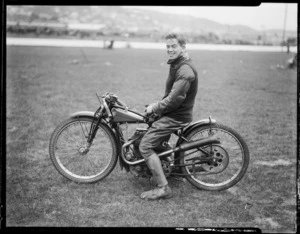 Speedway rider Clarrie Tonks, on motorcycle, at Kilbirnie stadium, Wellington