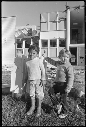 Boys in front of houses under demolition, Hampshire street, Porirua East - Photograph taken by Brett Richardson