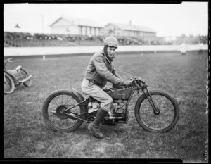 Lowndes, speedway rider, on Douglas motorcycle, at Kilbirnie stadium, Wellington