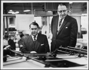 Minister of Finance, Mr Lake, and his Parliamentary Under Secretary, Mr Seath, watching the first copies of the 1961 budget coming off the press in Wellington