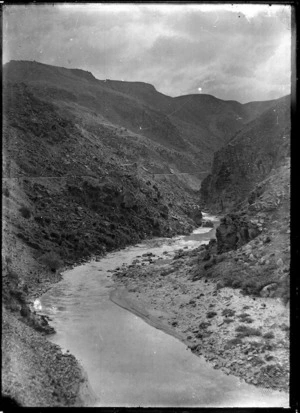 View of a railway line winding along the hills above the Taieri River, circa 1926