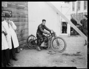 Wally Kilmister, speedway rider, on Douglas motorcycle, at Kilbirnie stadium, Wellington