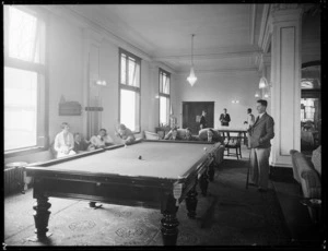 People playing billiards and table tennis at the Chateau Tongariro