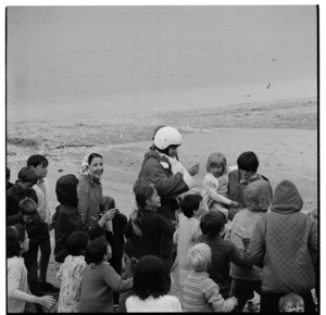 Arrival by parachute of Father Christmas at Oriental Bay, Wellington, 1970