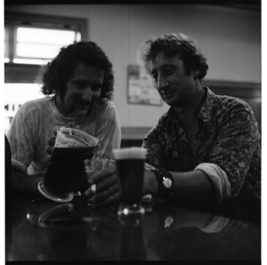 Inside a pub at Waihi, Coromandel, Barry Crump and friends. 1971