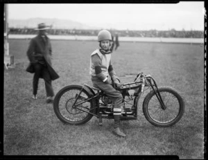 Mr Crafer, speedway rider, on Douglas motorcycle, at Kilbirnie stadium, Wellington