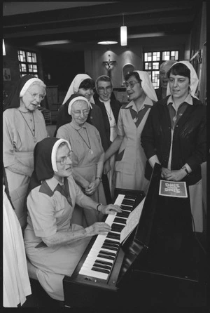 Sisters of Compassion sing along to their new organ.