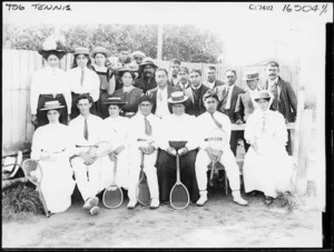 A trophy winning tennis team, and supporters, including many Maori, probably in the Wanganui region - Photograph taken by Frank J Denton