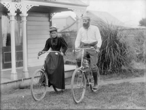 Two unidentified members of the Curtis family on bicycles