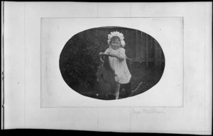 Joyce Matthews as a small girl on a rocking horse, circa 1910