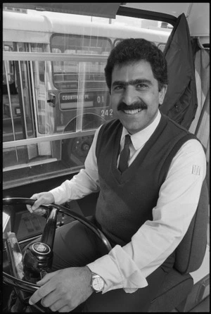 Iranian refugee Shahab Forouzandeh at the wheel of a Wellington bus - Photograph taken by Ray Pigney