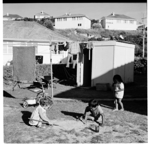 Children playing in an unidentified suburban back yard, 1973.