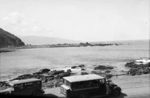 Houghton Bay, Wellington, showing a Bell Bus Company sightseeing vehicle in the foreground