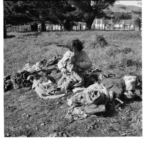 Te Runa family, Ruatoria - 'Mutu' playing with the washing
