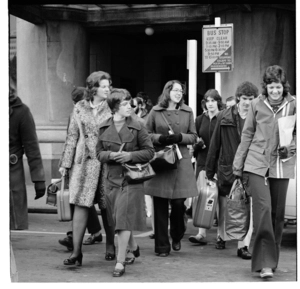 Men and women emerging from the Wellington Railway Station