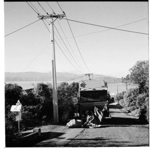 Rubbish truck on its rounds, possibly in the Khandallah area, 1974.