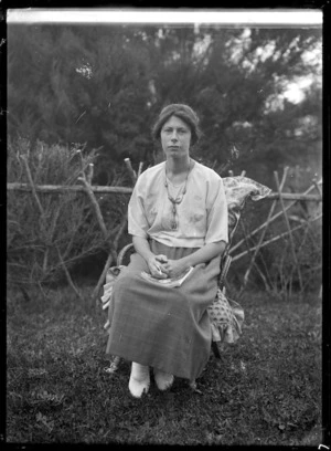 Phyllis Godber seated in a garden.