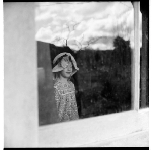 Lisa van Hulst reflected in a window