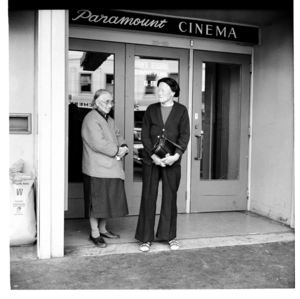 In the doorway of the Paramount Cinema, Wellington; and, primary school children in a classroom at Thorndon School