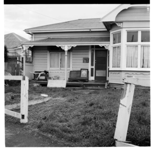 A verandah on a house in an unidentified location; and, patched gang members at Parliament