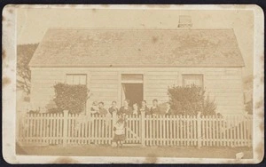 Photographer unknown :Family group portrait outside house