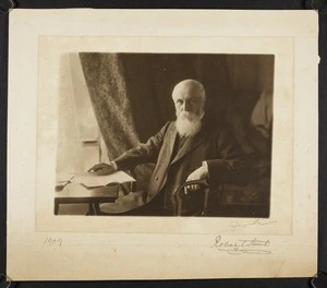 Portrait of Sir Robert Stout sitting at a desk
