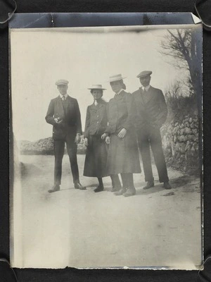 Two men and two women standing on a path