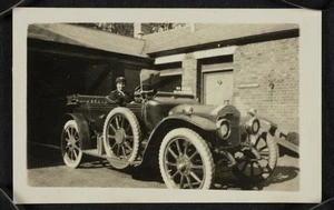 Agnes Isobel Pearce (later Stout) in the driver's seat of an open top car