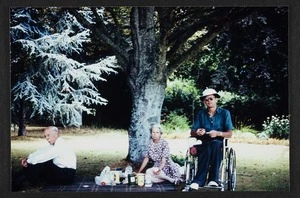 Agnes Isobel Stout and Thomas Duncan Macgregor Stout with their son, Dr John David Stout, having a picnic in the grounds of Massey University, Palmerston North