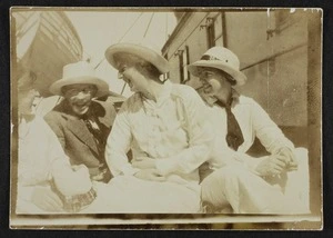 Three women and a man, probably friends or members of the Pearce family, on the deck of a ship