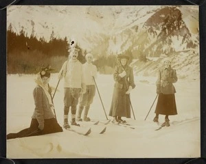 Group of men and women with skis on the snow, Switzerland