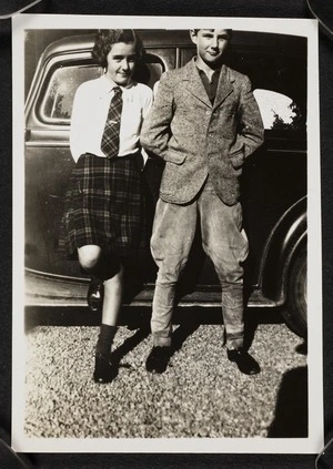 Vida Mary Stout and John David Stout leaning on a car
