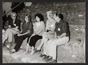 Dr Vida Stout sitting on steps with four others