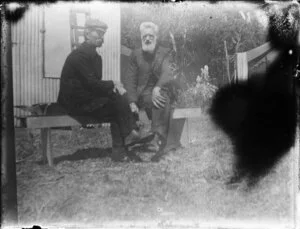 Two men sitting on bench