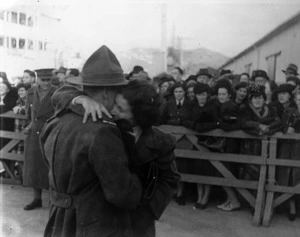 World War II serviceman embraces a woman after his return to Wellington on the Wanganella