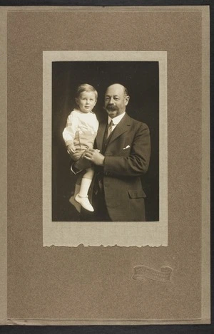 Portrait of Arthur Edward Pearce holding his grandchild Robert Edward Stout