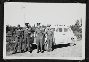 Thomas Duncan McGregor Stout and three other men in army uniform standing in front of a car, Egypt
