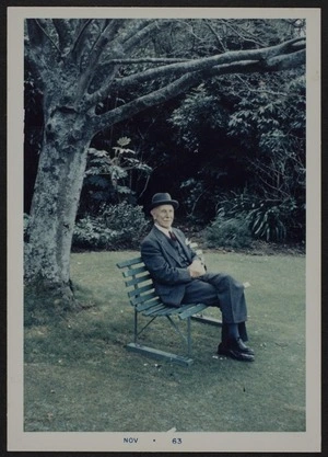 Thomas Duncan Macgregor Stout sitting on a park bench, Massey University, Palmerston North