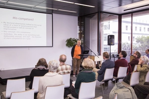 Digital photographs of Bruce Russell delivering a lecture