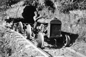 William Miller Kinvig driving a converted tractor on a logging railway