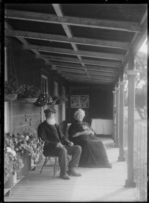 Mr and Mrs Diedrich Papen sitting on the verandah of Henderson House, Chatham Islands