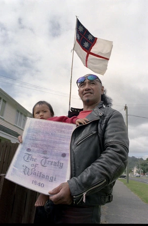 Te Kuru Pou-namu Wahanga Pairama and daughter Roimata, with flag of Confederation of United Tribes of New Zealand - Photographs taken by Phil Reid