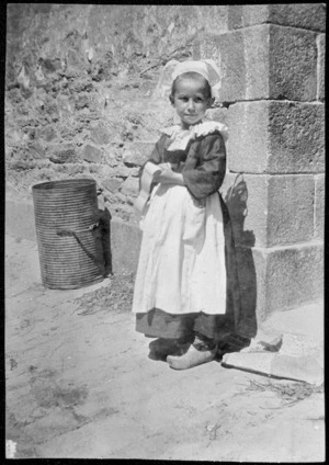 Child in traditional dress, Concarneau, Brittany, France